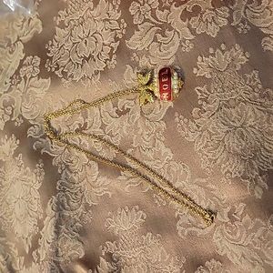 Festive Avon noel necklace in gold tone.